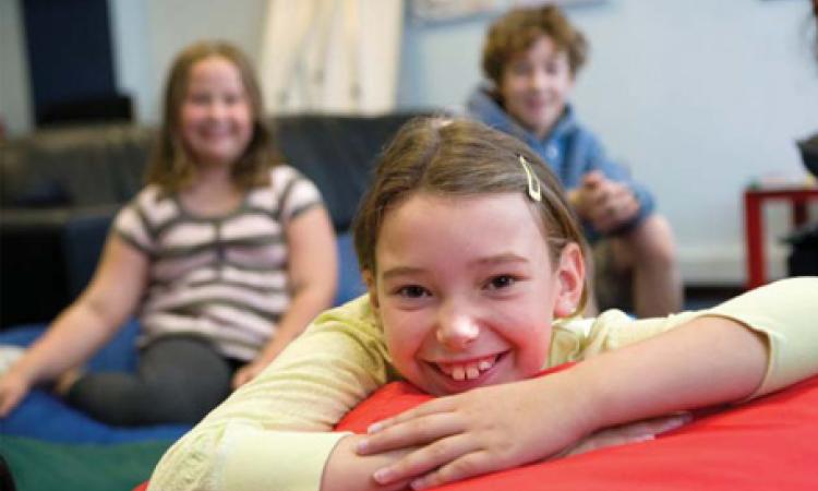 girl-smiling-1 Girl smiling in a room