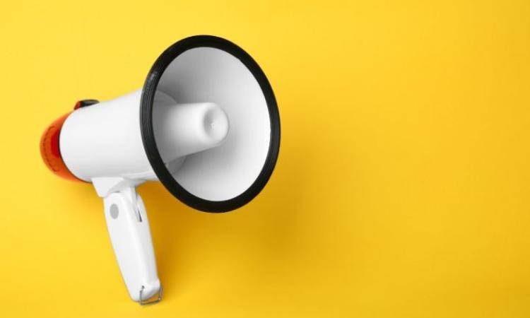 megaphone-yellow-1 Megaphone on yellow background
